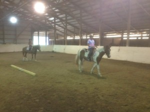 girls riding indoor arena